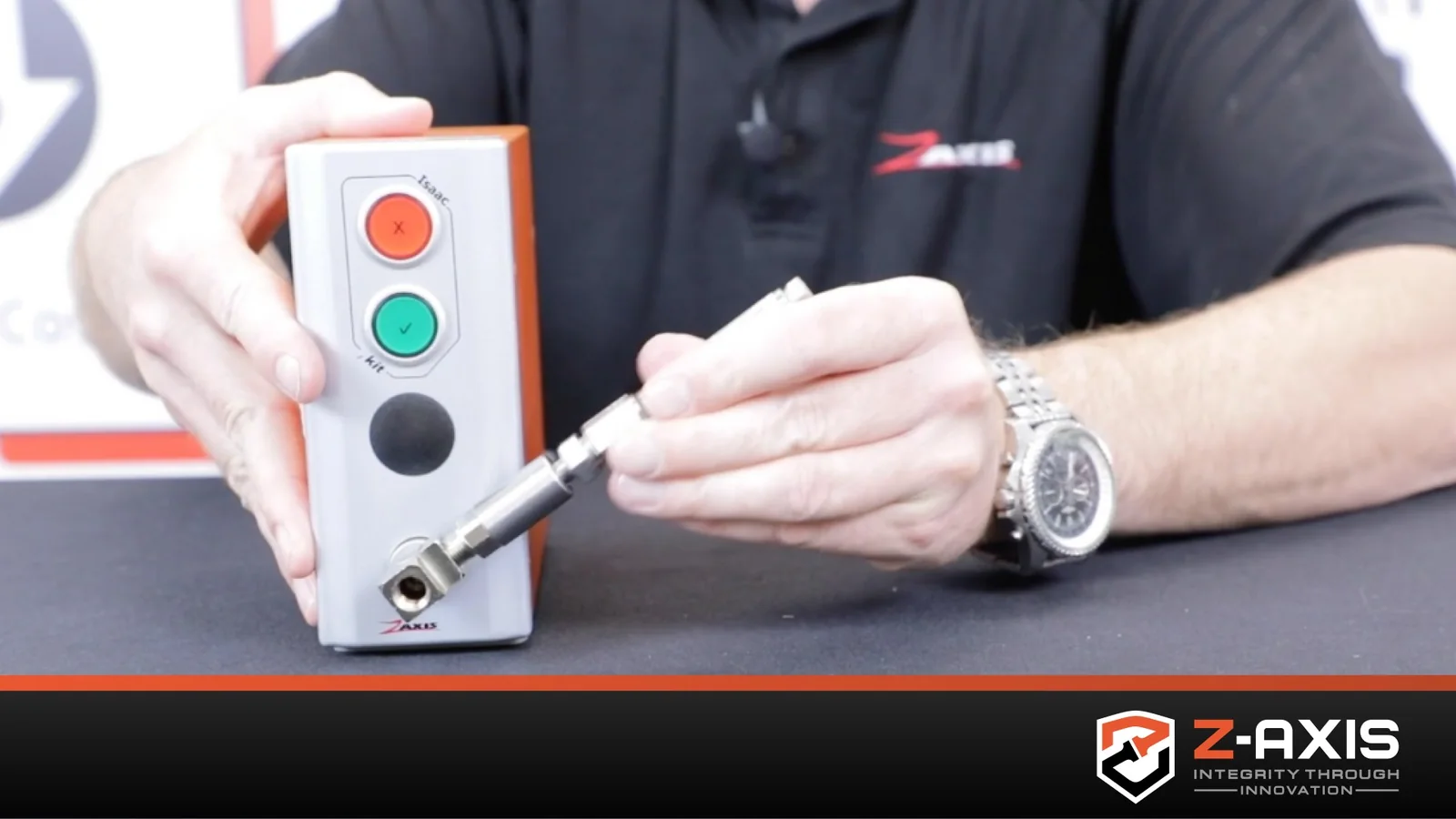 Zaxis employee demonstrating the functions of the iKit Automated Leak Tester