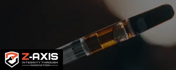 Vape cartridge closeup with Z-Axis logo and tagline in bottom left