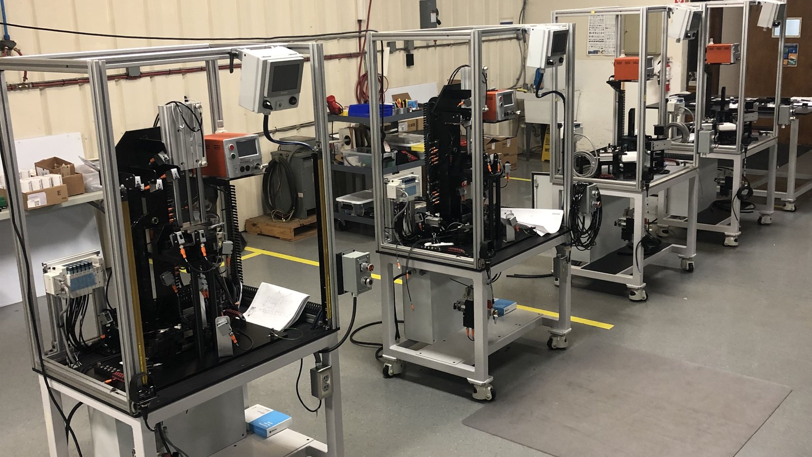 Automated leak-test cells on a production floor