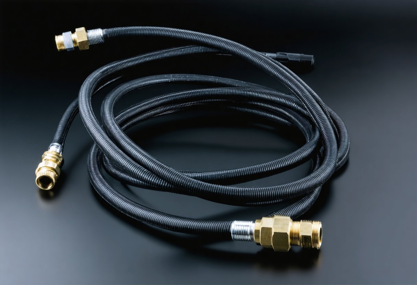 Coolant hose assembly with crimped stainless end fittings and brass quick-disconnect coupling