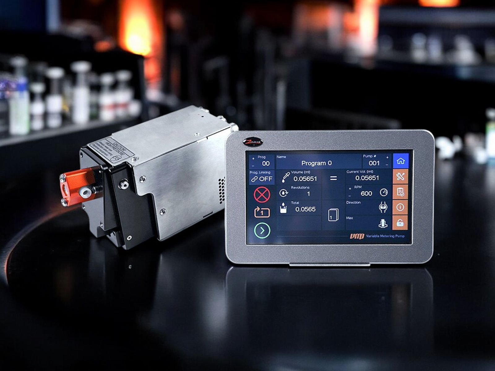 M-Series microliter metering pump and touchscreen controller on a dark R&D laboratory bench