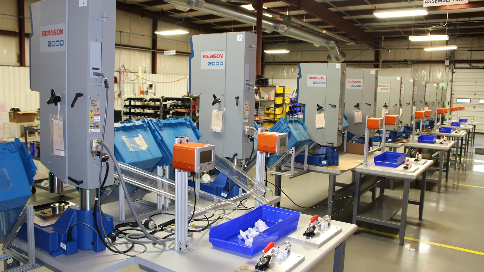 Production floor with Zaxis leak testers at assembly stations